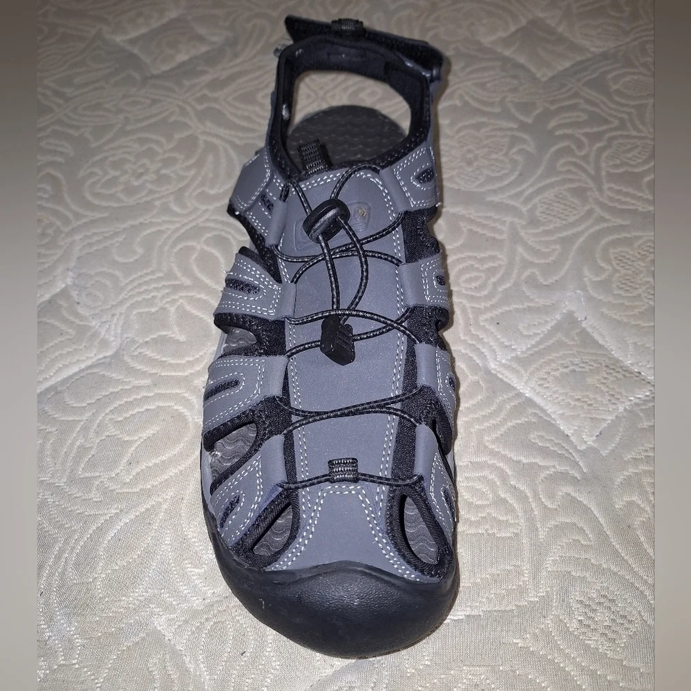 A pair of Coleman George sandals in a men's size 13M. They're in excellent shape